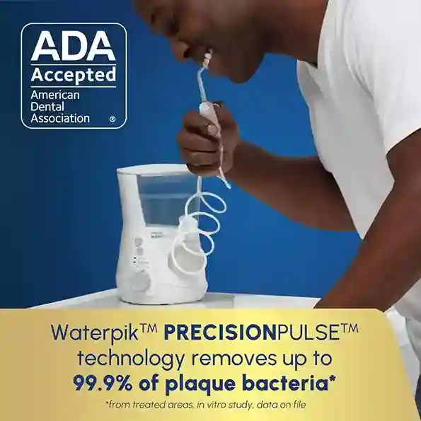Person using Waterpik WP 660 countertop water flosser